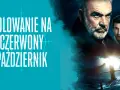 Plakat filmu "Polowanie na Czerwony Październik" z Seanem Connerym i Alec'iem Baldwinem. Na pierwszym planie okręt podwodny na wzburzonym morzu.