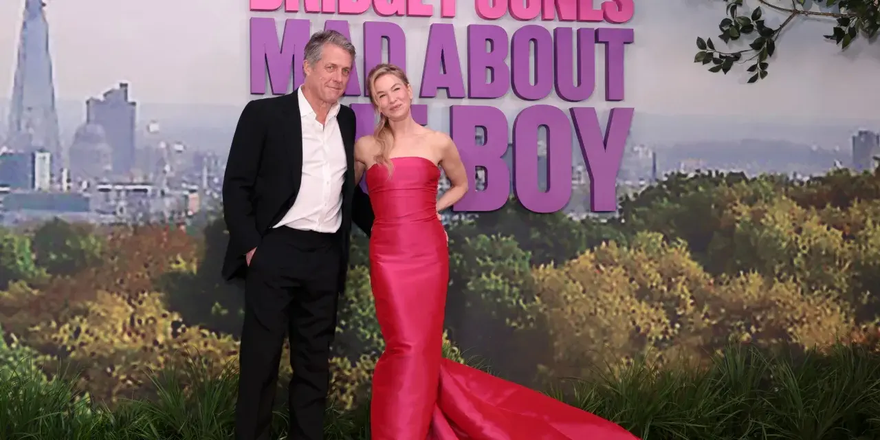 Hugh Grant i Renée Zellweger na premierze "Bridget Jones: Mad About Boy". Gwiazdy prezentują się elegancko na tle londyńskiego krajobrazu i napisu "Bridget Jones".